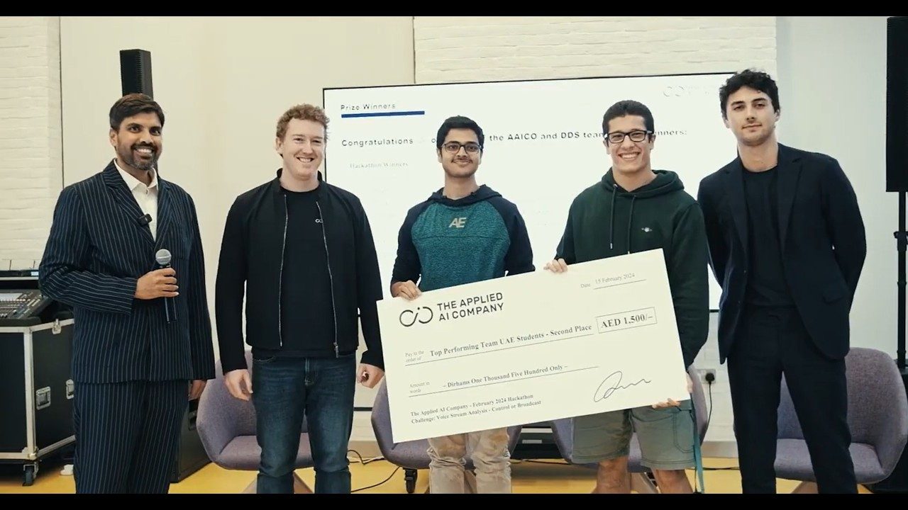 A prize presentation at the hackathon: five people holding an oversized cheque for the second-placed team.